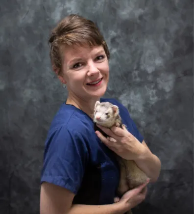 Jenna holding a light colored ferret